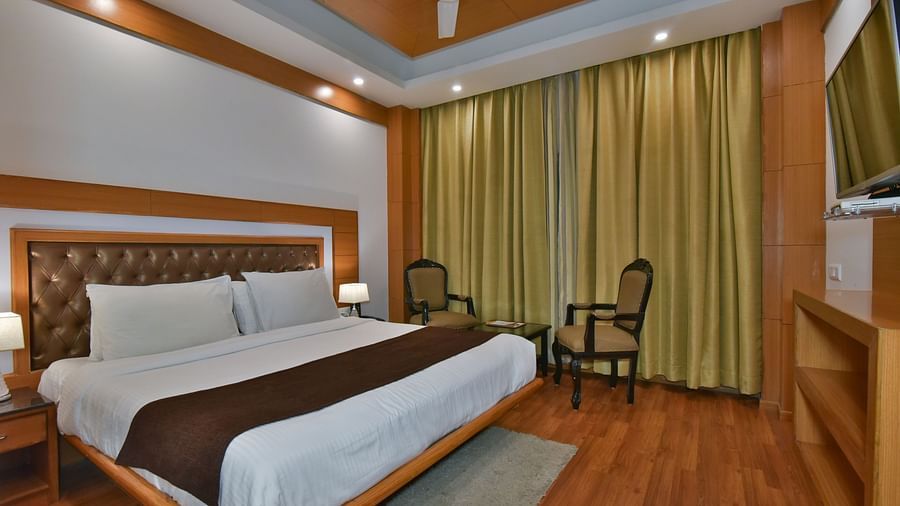 A large bed in Luxury Room Without Balcony at DLS Highland Resort and Spa, Mussoorie.